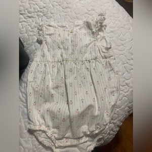 Infant girl’s romper. Small rosebud design.